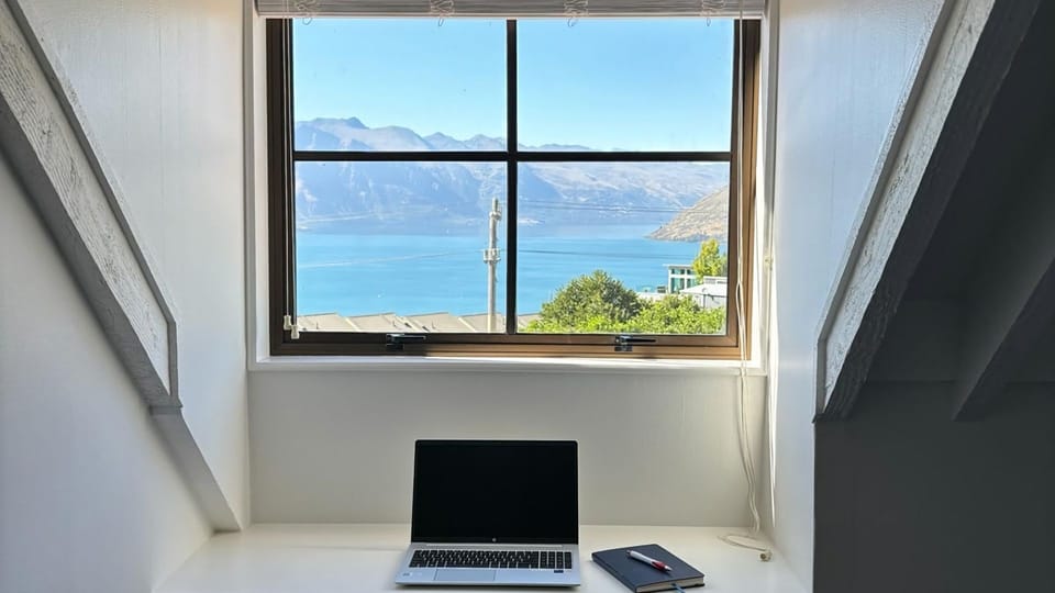 Bedrooms 2 and 3 both offer a desk area with lake and mountain views (laptop not included)