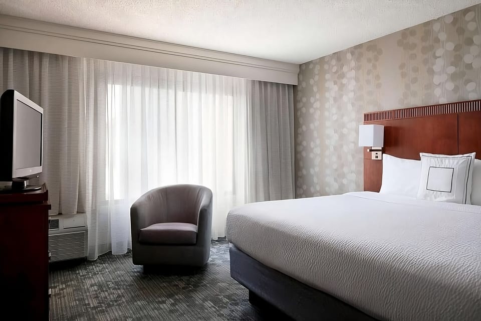 Drift off in a serene king room with plush pillows.