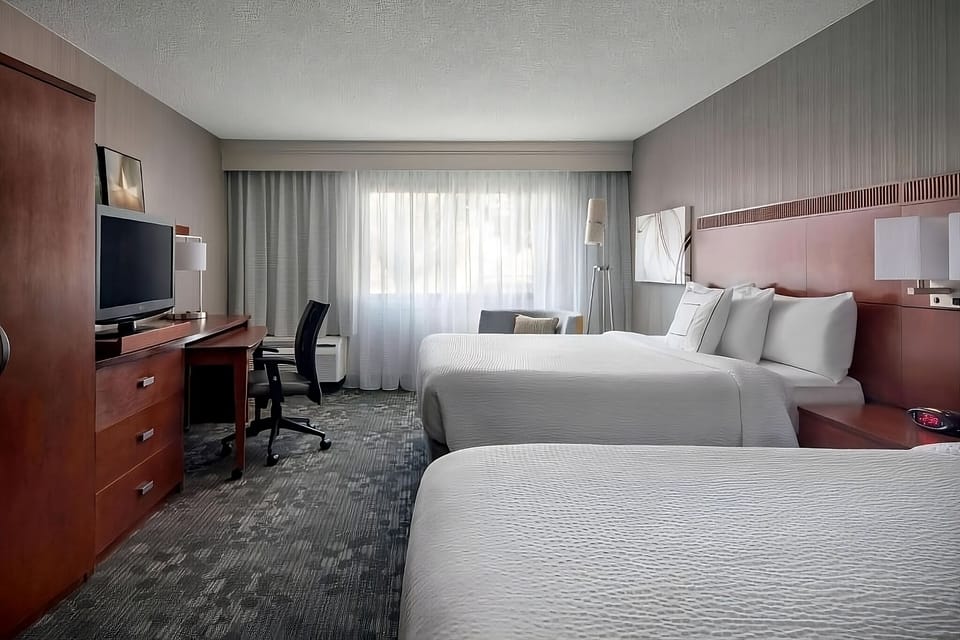 Settle into two crisp beds with an easy work desk.