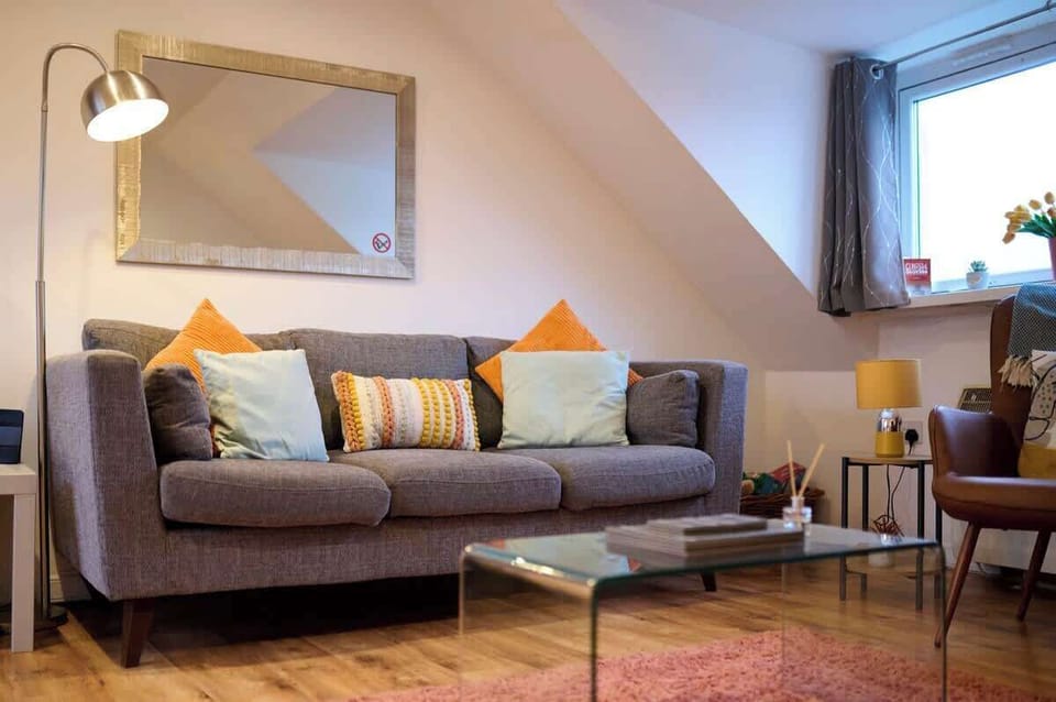 Living area with ample natural lighting and comfortable seating
