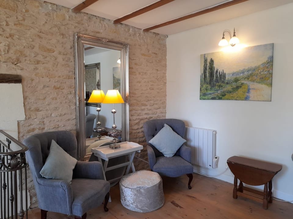 A quiet reading area in the salon. Monet canvases feature throughout the property.
