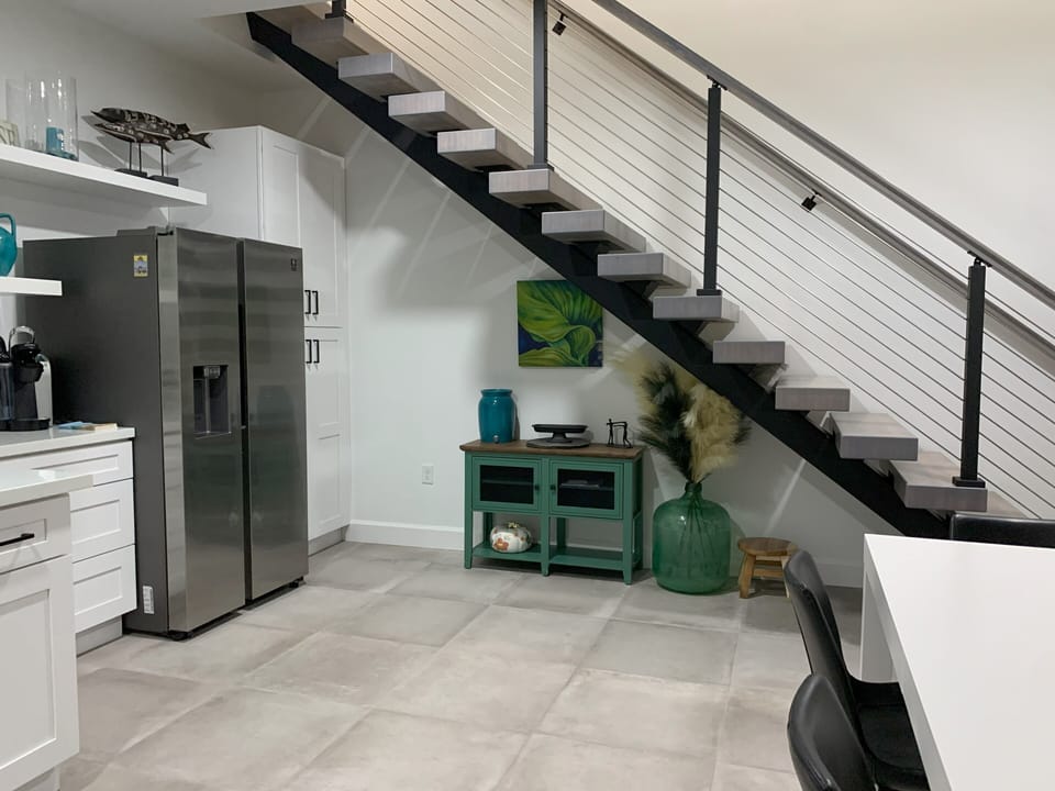 Stairs to 3 bedrooms, 2 full baths and living/den space 
