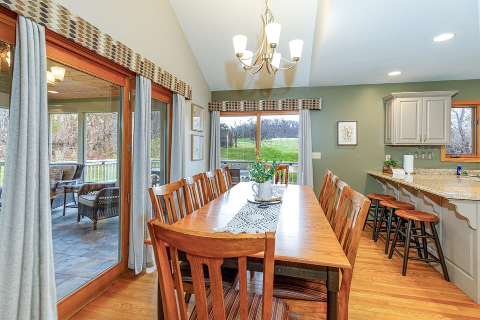 The dining table seats 8 with additional seating available at the breakfast bar