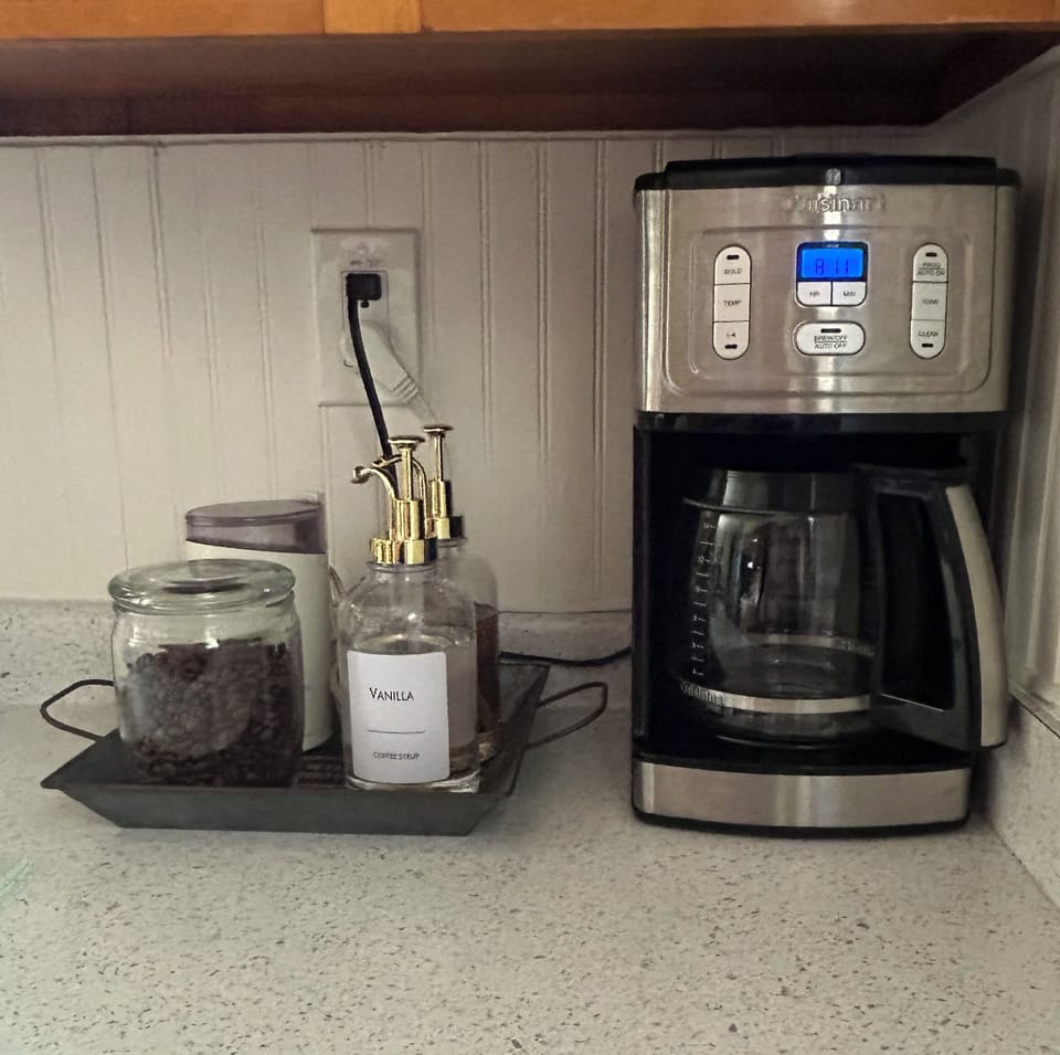 Coffee bar includes sweeteners and creamers.