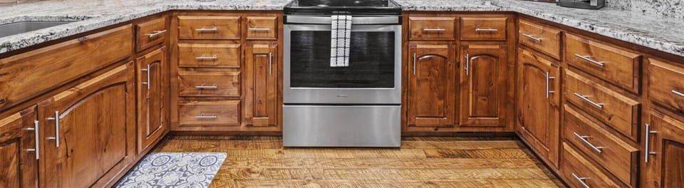 Our kitchen features modern appliances and rustic cabinetry, perfect for family meals.