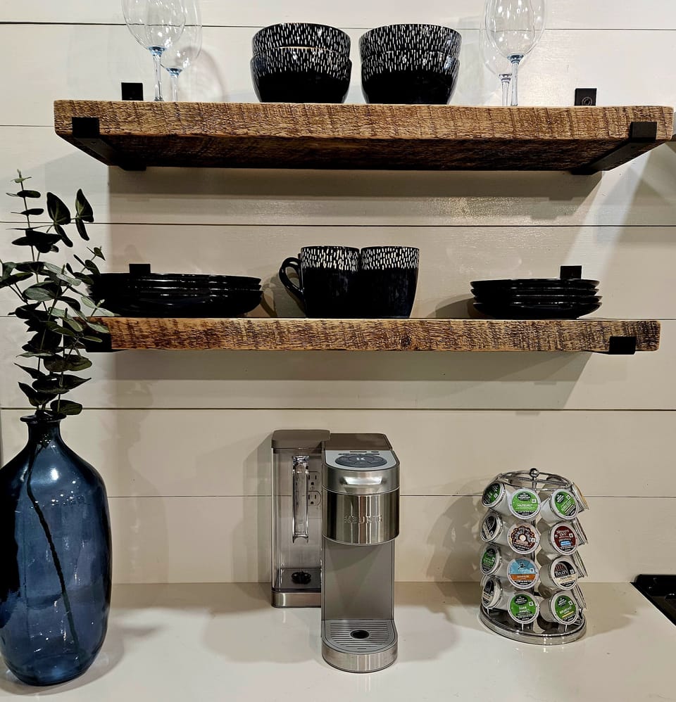 Open  rustic shelfing and coffee bar