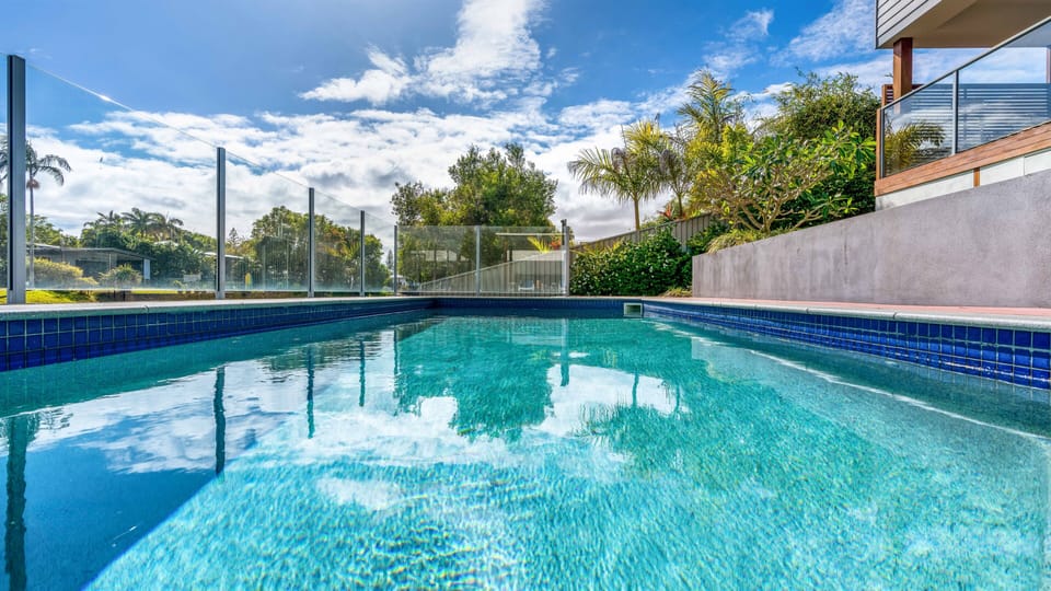 Pool and gardens leading down to the creek