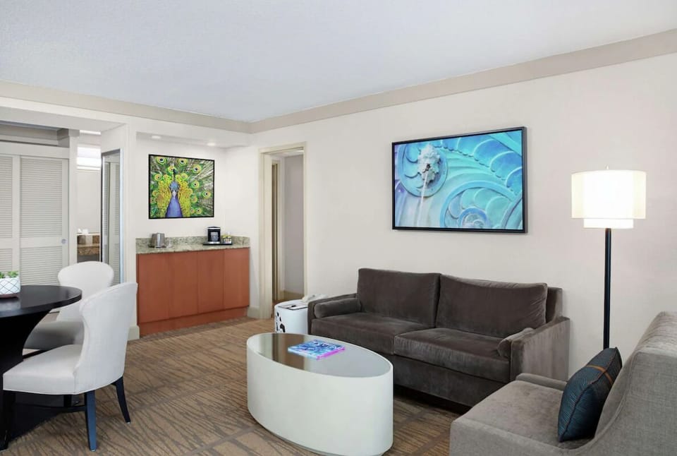 Lounge together in an airy sitting room with modern art.