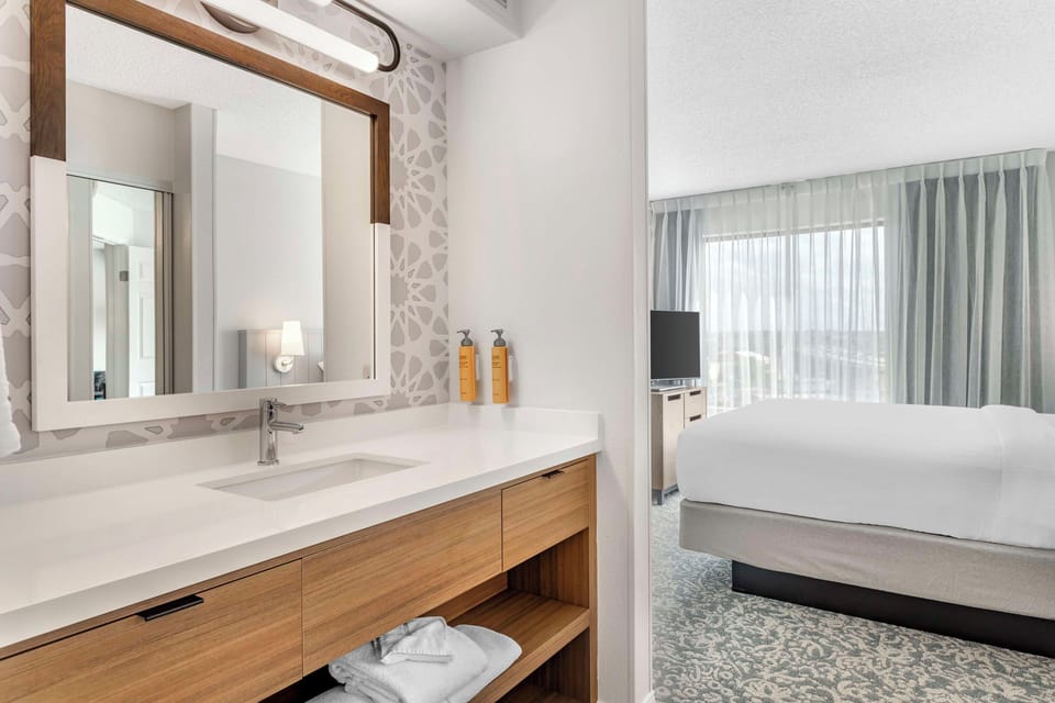 Refresh at the sleek vanity before sinking into bed.