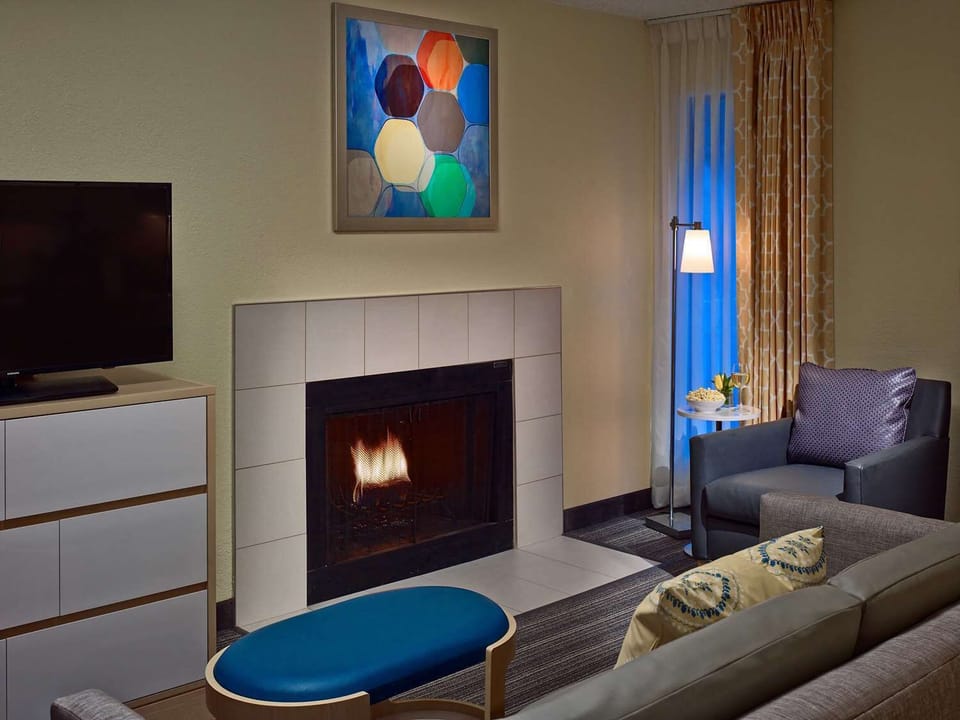 Cozy up by the fireplace for a relaxed evening in.