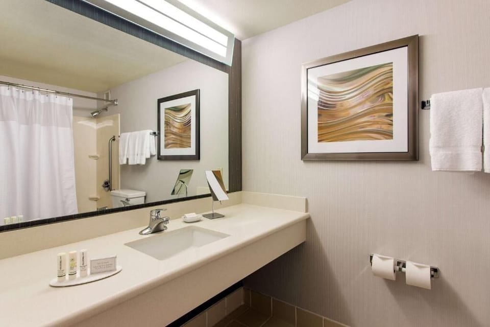 Refresh easily with a wide vanity and bright lighting.