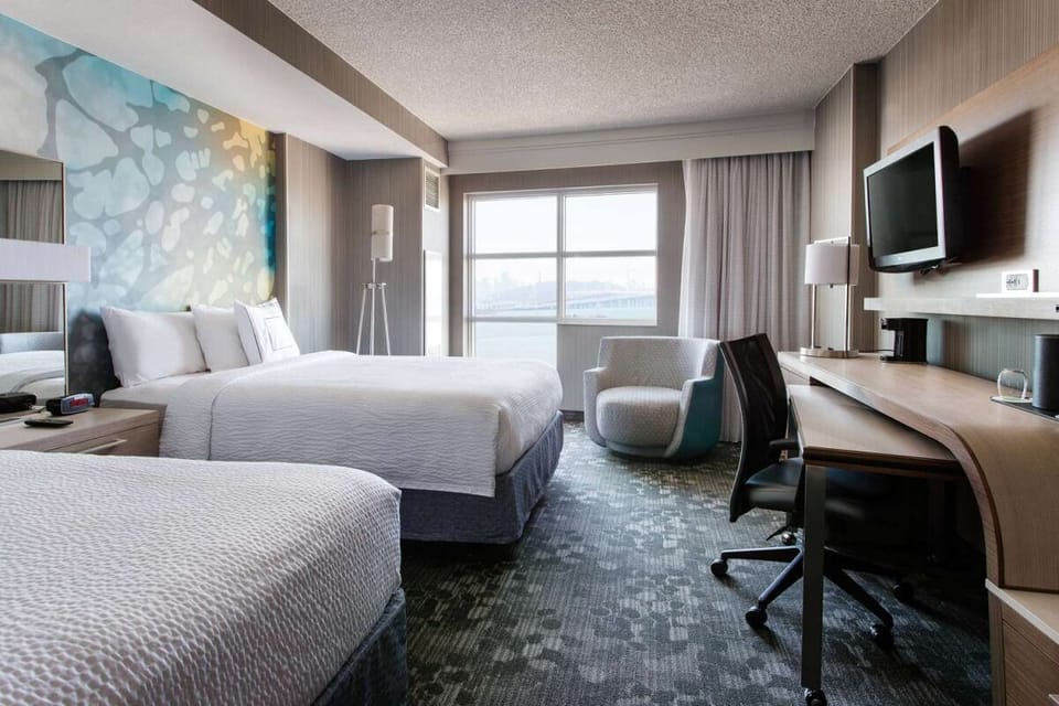 Settle into crisp linens and a roomy workspace retreat.