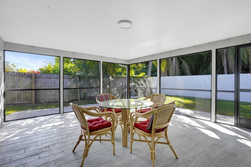 Our cottage has casual dining outdoors under the screened lanai