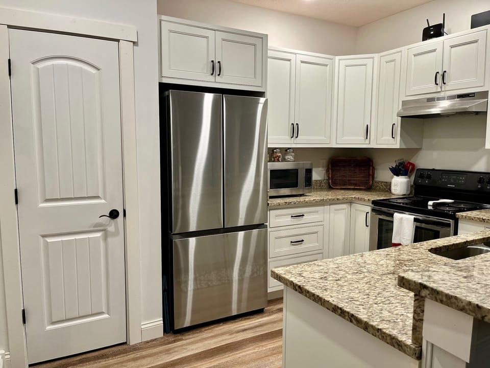 New stainless steel appliances, granite counter tops and large pantry.