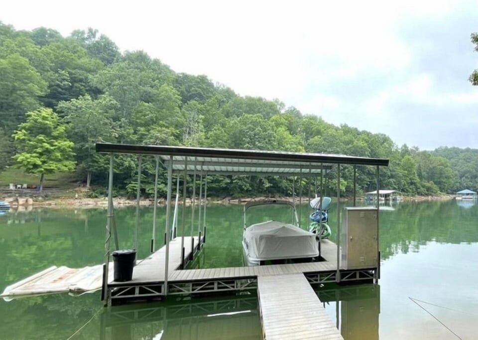 Covered dock with swimming ladder and jet ski port. 
