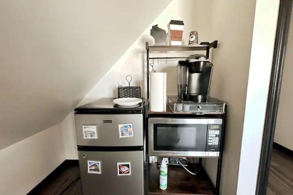 Kitchenette is equipped with a mini fridge, Keurig coffee maker, and microwave