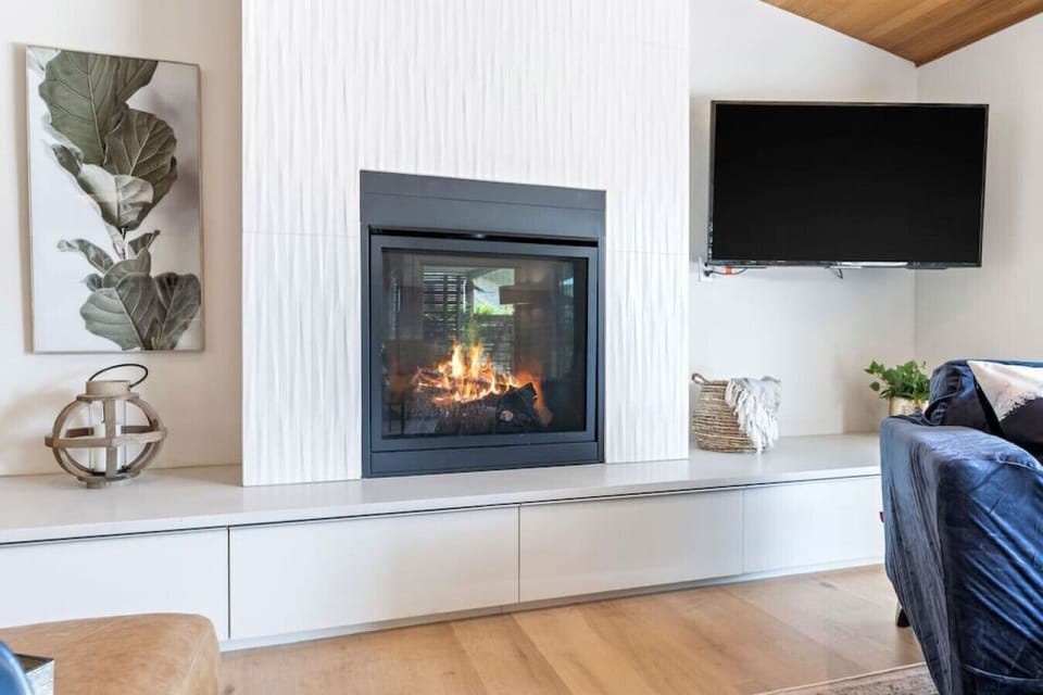 Elegant floor to ceiling mantel and gas fireplace!