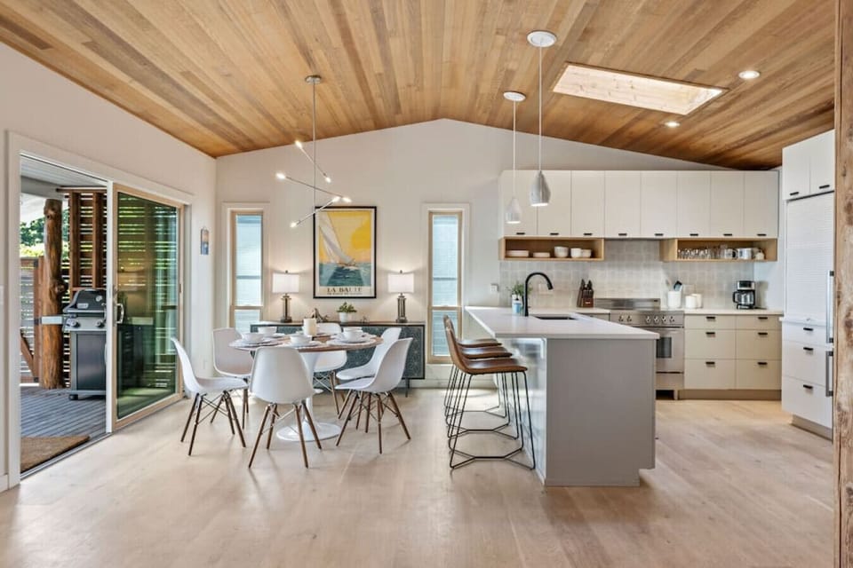 Open kitchen and dining area with large sliding glass door leading to the BBQ!