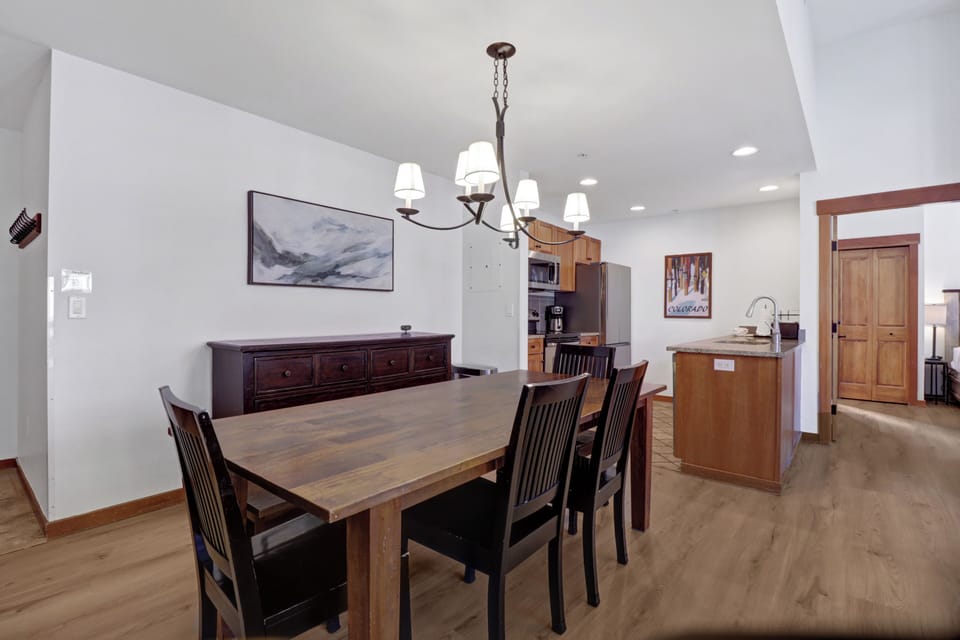 Gather around this beautiful dining table where your mornings begin with coffee and evenings end with laughter. The open kitchen layout lets you cook while staying connected to your group.