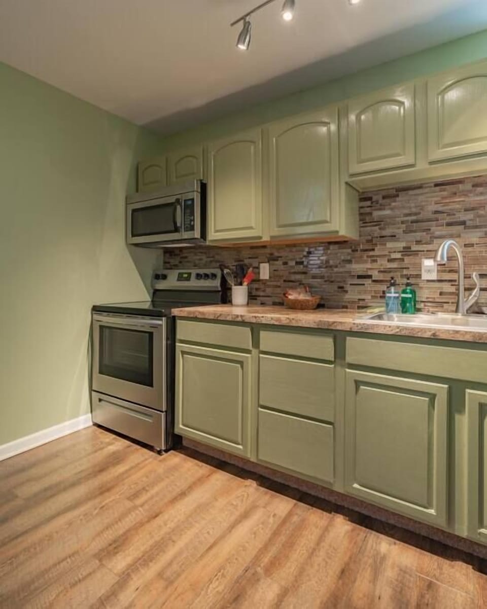 Kitchen area is fully stocked with with utensils and appliances