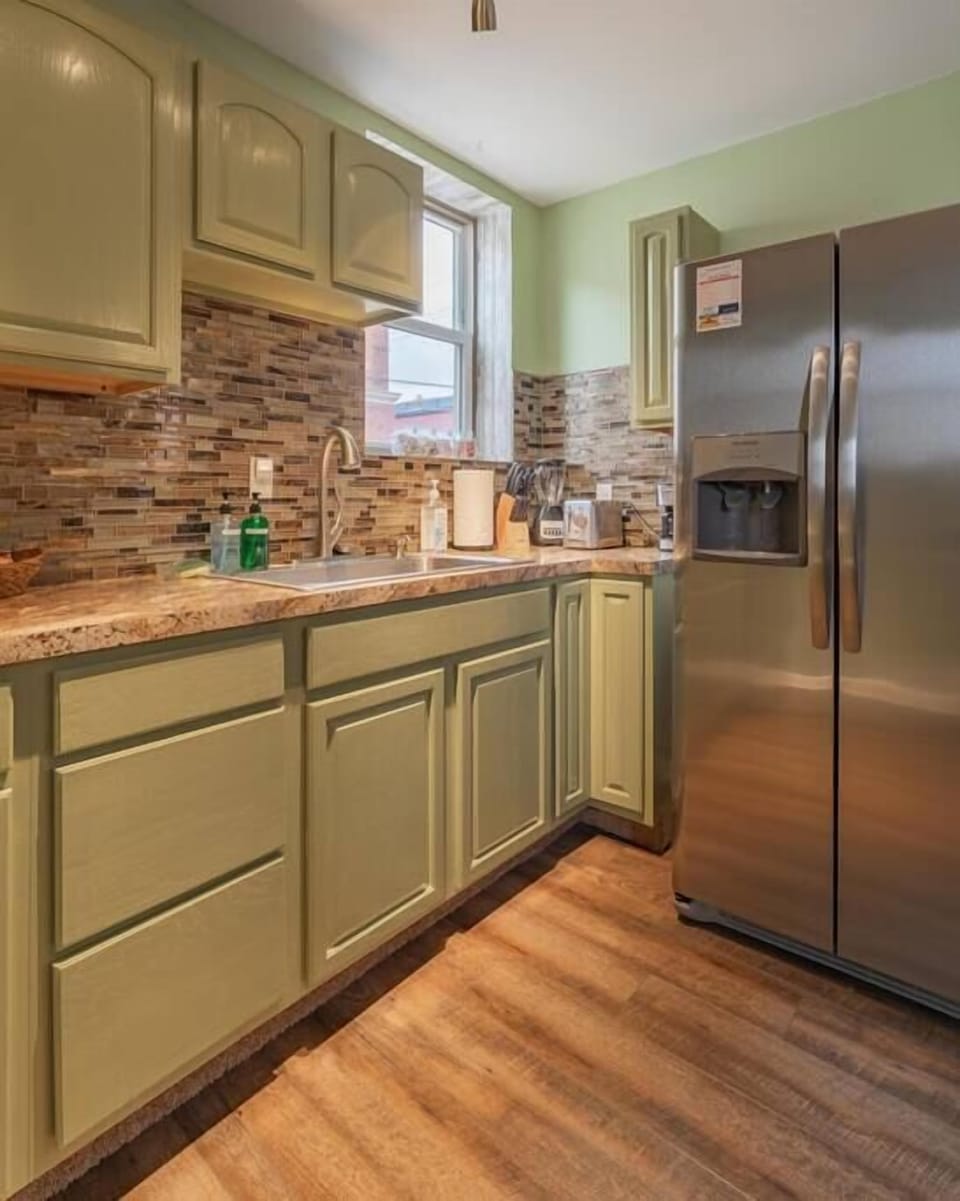 Fridge has ice-maker and water dispenser 