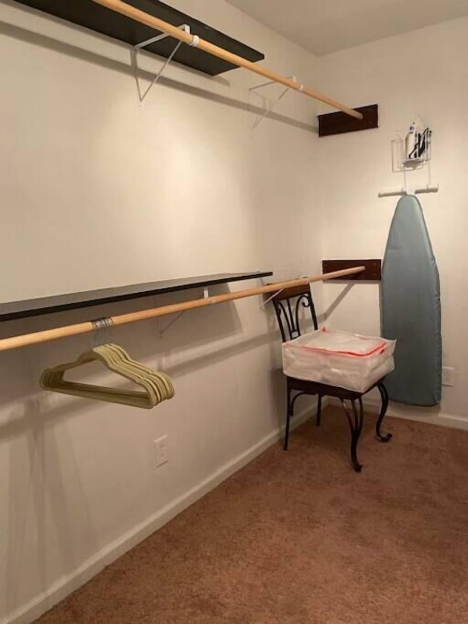 Plenty of space and hanging racks in bedroom walk in closet