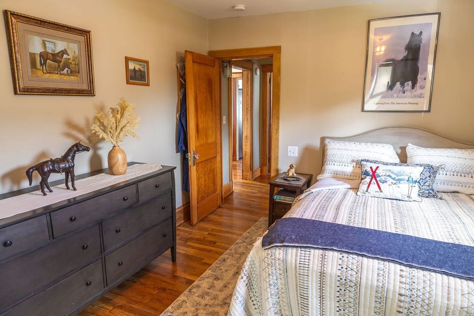 Primary bedroom with comfortable bed and clean linens