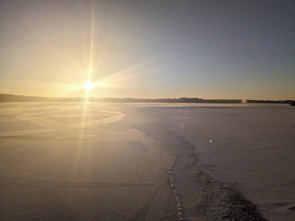 Winter: Frozen Lake Mohawksin, snowmobile from shore. The lake is calling!