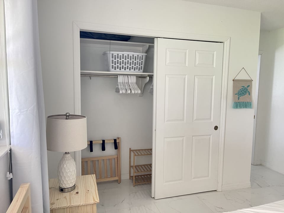 Spacious closet located in master bedroom with plenty of hangers.