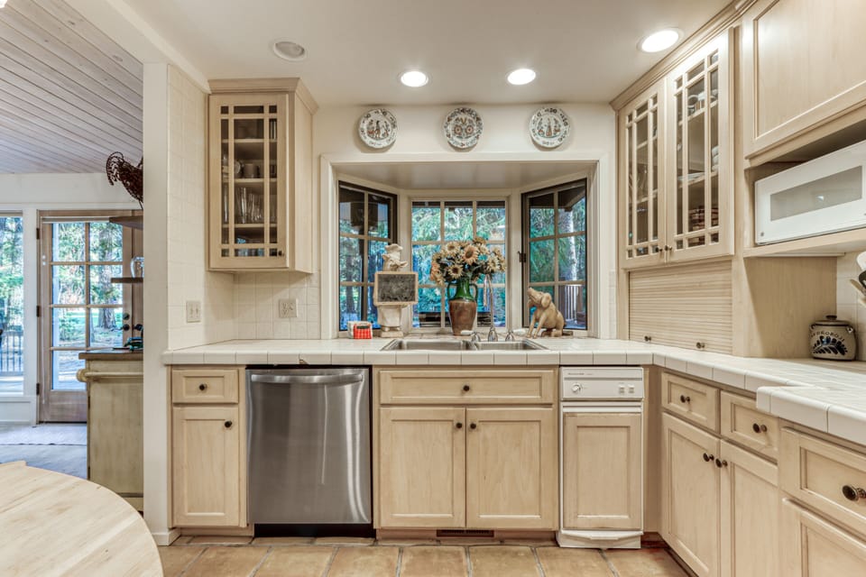 Kitchen with dishwasher and  trash compactor