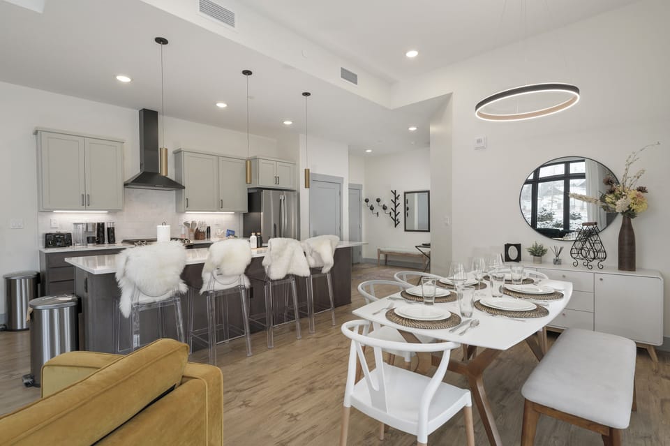 Your open-concept kitchen and dining space invites you to gather, cook, and create memories with modern appliances and stylish seating for six.