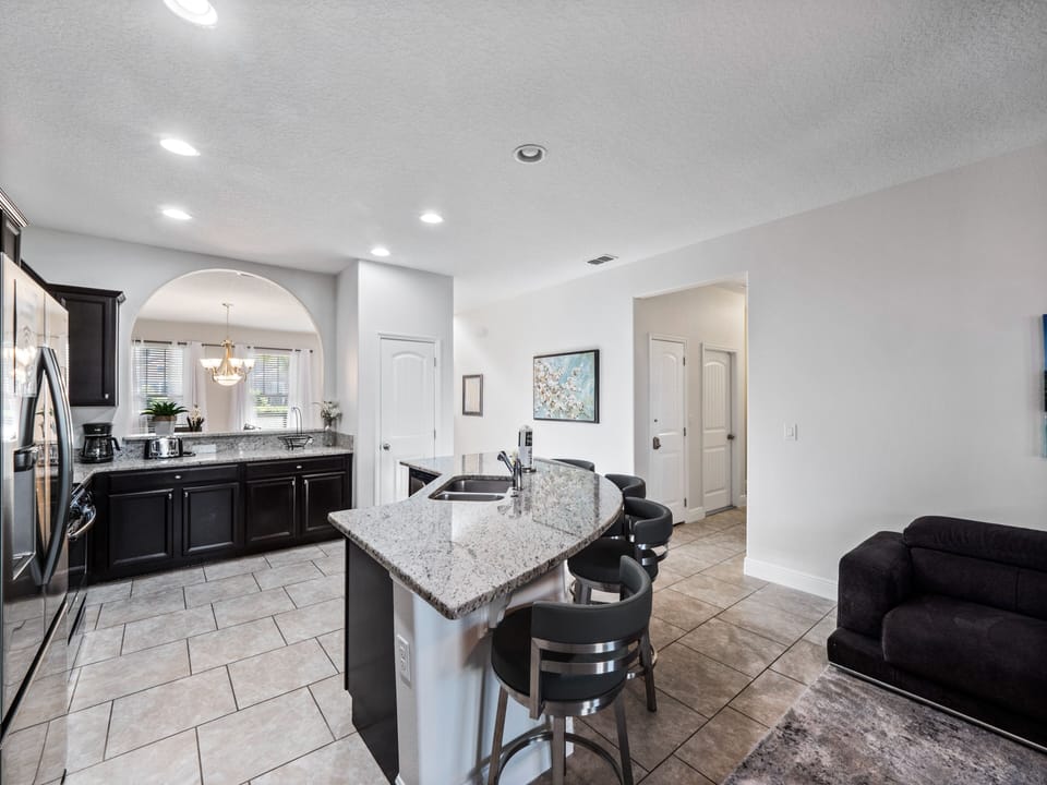 Modern Full Sized Kitchen Including Coffee Maker, Blender, Toaster, Basic Kitchen Starter Essentials and Bar Stool Seating
