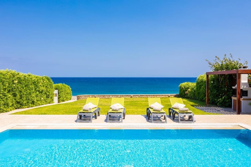 Private pool, terrace, and garden with panoramic sea views