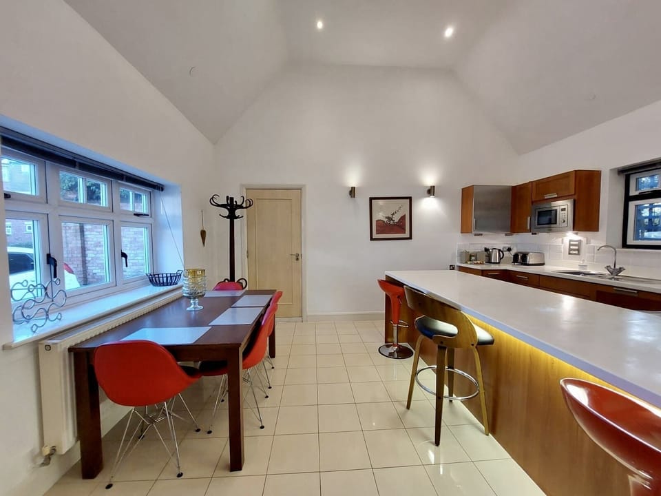 Full size kitchen, bar and dining area.