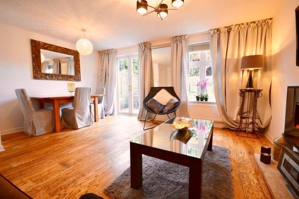 Living room with dining area. Patio doors to the garden. 
