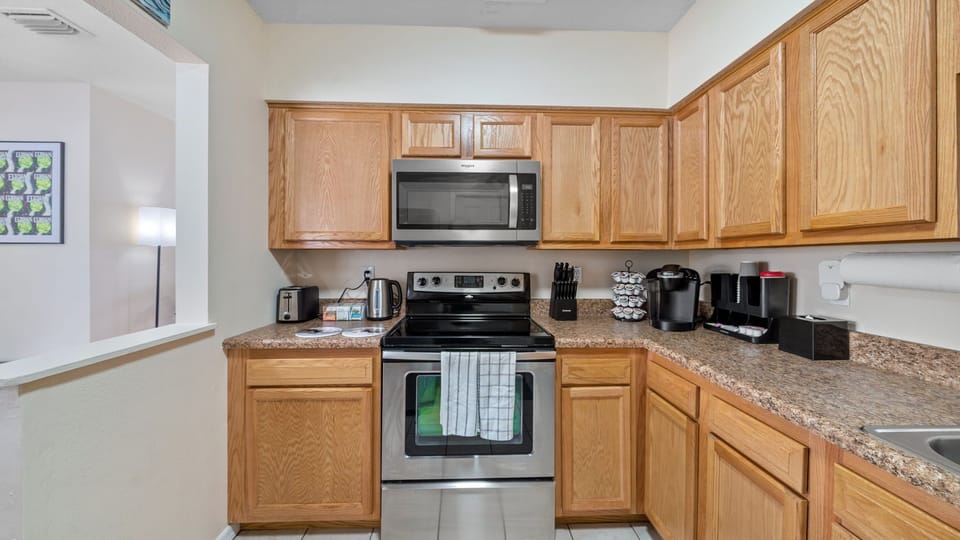 Wide kitchen view showing full prep and storage space