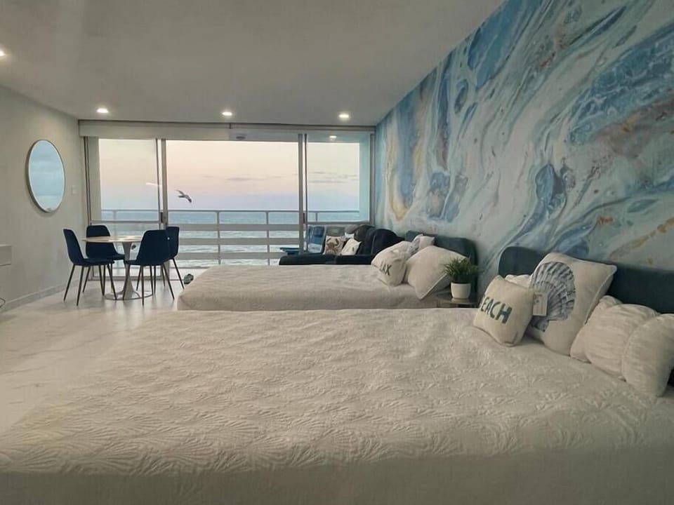 Enjoy two comfortable beds overlooking the beautiful view of the ocean