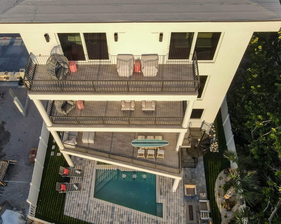 Looking down - third, second, first floor balconies, pool.