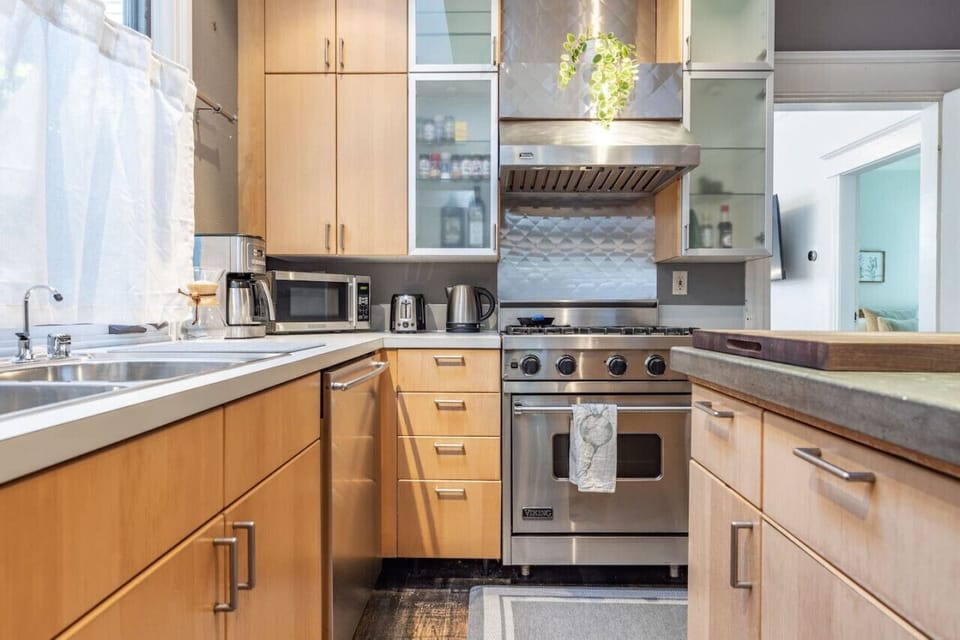 All stainless steel appliances, featuring a gas stove.