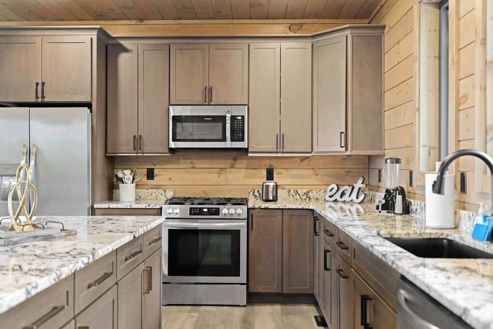 A blend of modern and rustic elements creates a warm and stylish kitchen, perfect for creating culinary masterpieces.