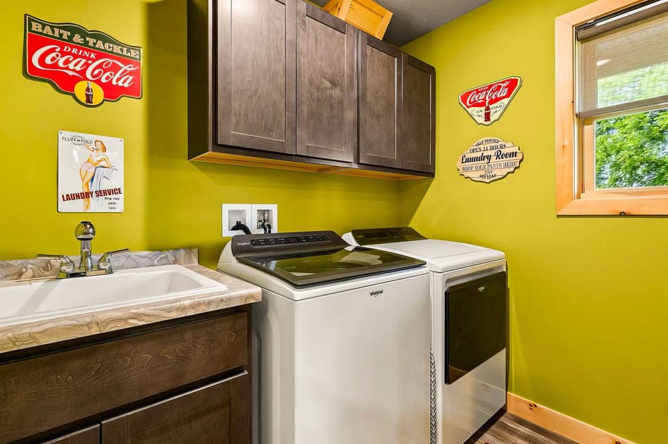 Complete laundry room with washer, dryer, and cleaning products available for your use