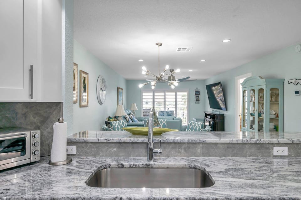 Kitchen Sink Located In Peninsula Providing Open and Unobstructed Views 