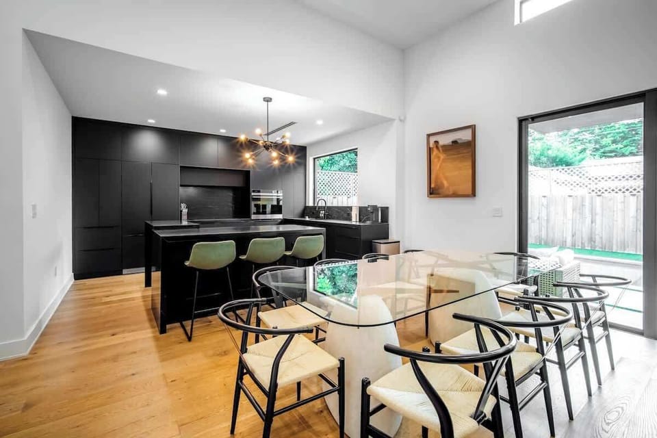 Cook, dine, and connect in this stunning open-concept space. The sleek, fully-equipped kitchen flows seamlessly into the elegant dining area, making it perfect for group meals and memorable conversations.