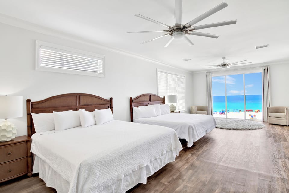 Bedroom 7 has a TV, balcony access, private bathroom and 2 King beds - sleeps 4