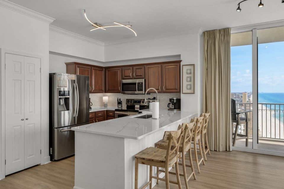 Newly cut down bar to counter height level provides a wide serving/dining space 