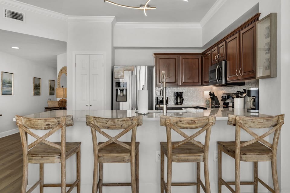 Pantry and Stainless Appliances - four bar stools.