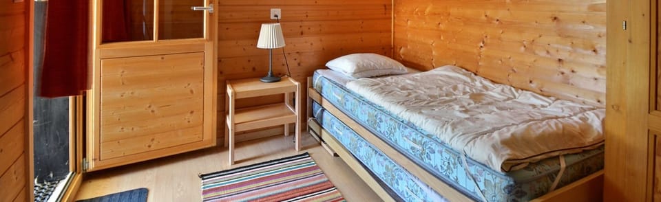 Bedroom 3 with 2 beds and sink