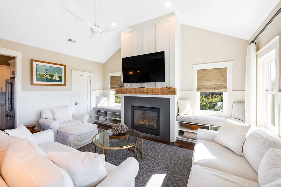 Plenty of seating to gather around in the living area with gas fireplace