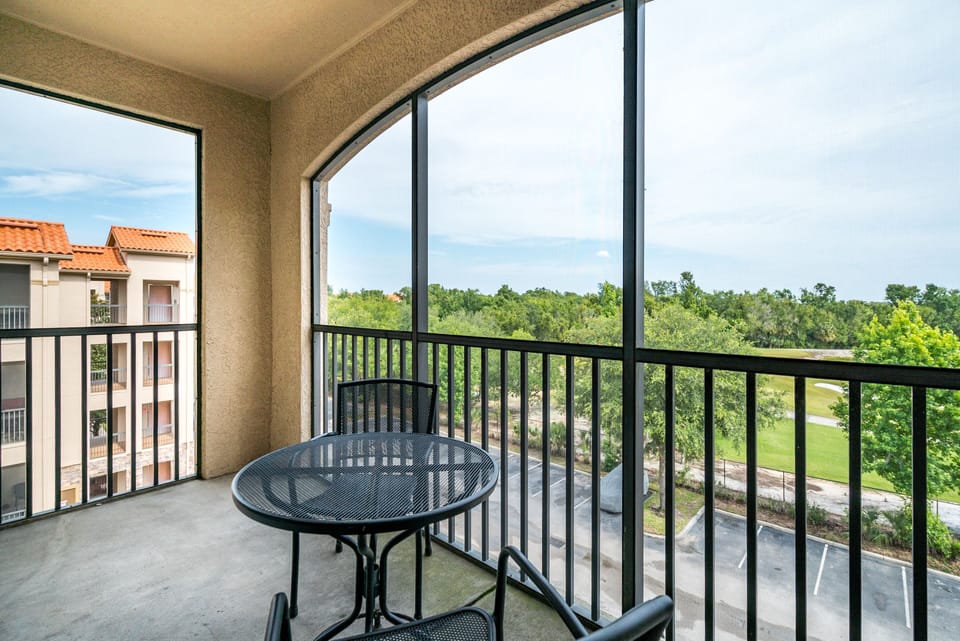 Screened patio with golf course view