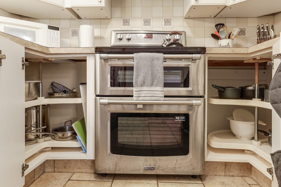 Fully stocked kitchen with pots and pans
